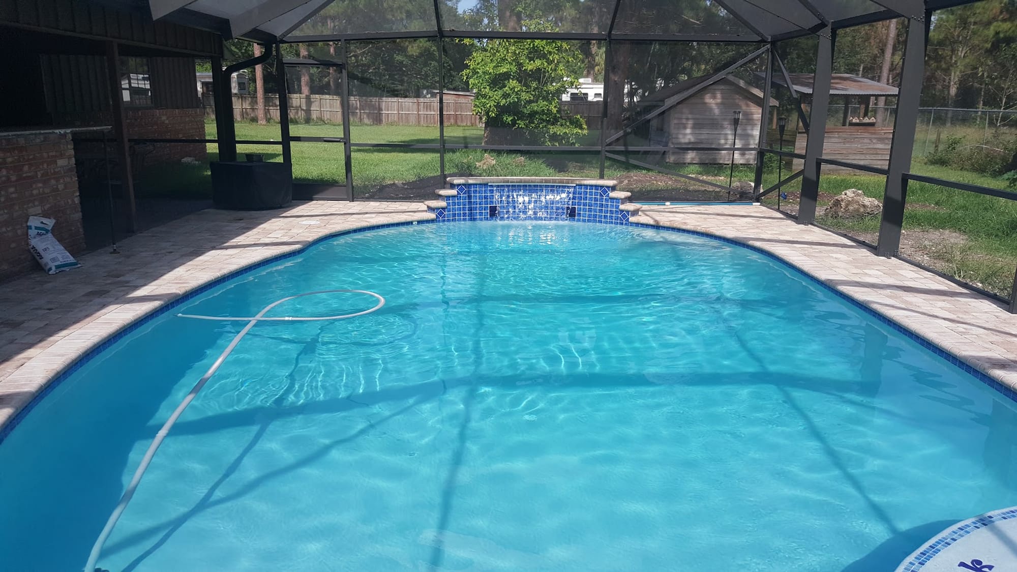 Sparkling backyard swimming pool at a South Florida home serviced by Premier Pool Care